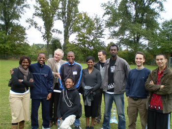 63. Jacques Cheminade and youth posing for a group photo