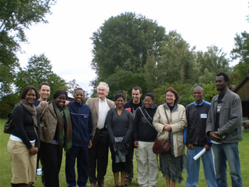 64. Helga, Jacques Cheminade and youth  posing for photo