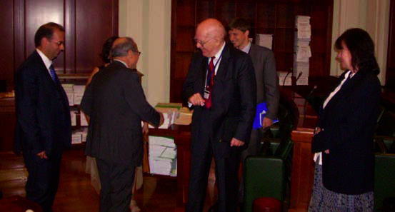Lyndon LaRouche (center) and Helga Zepp- LaRouche (right) are welcomed in Rome by members of the Senate Labor and Social Security Committee.